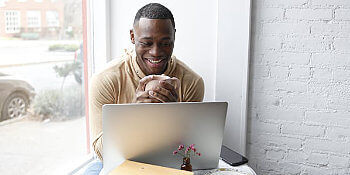 Marketer using search engine on laptop