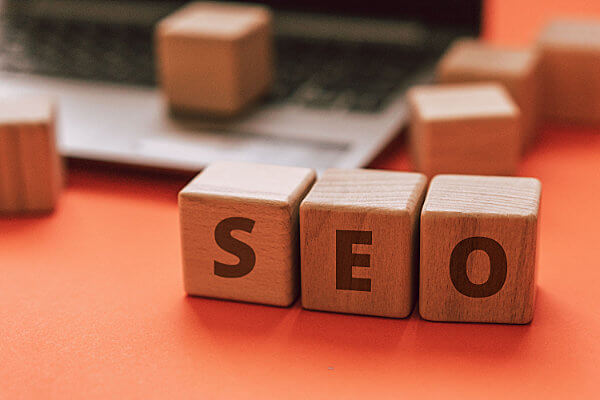 Wooden blocks spelling out SEO for What are SEO Keywords?