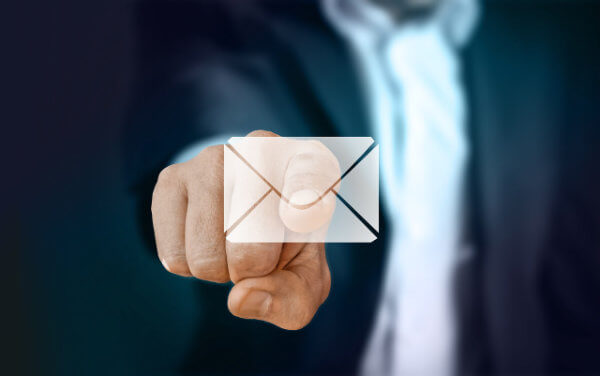 Email Marketing Agency:Man touching an virtual email envelope icon